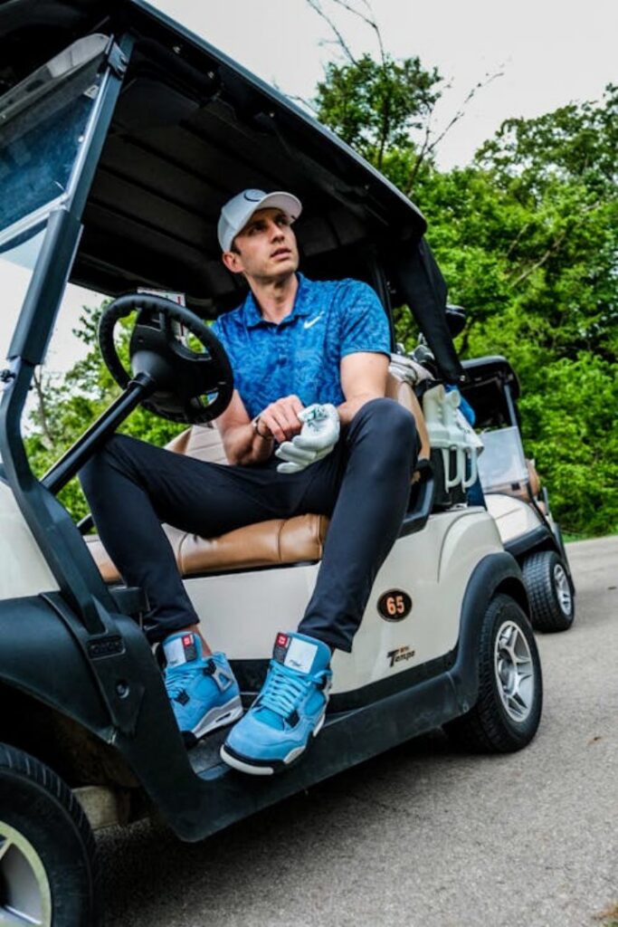 A person sitting in a golf cart